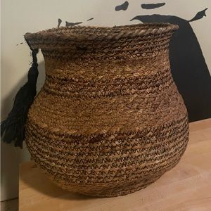 Woven basket with tassel